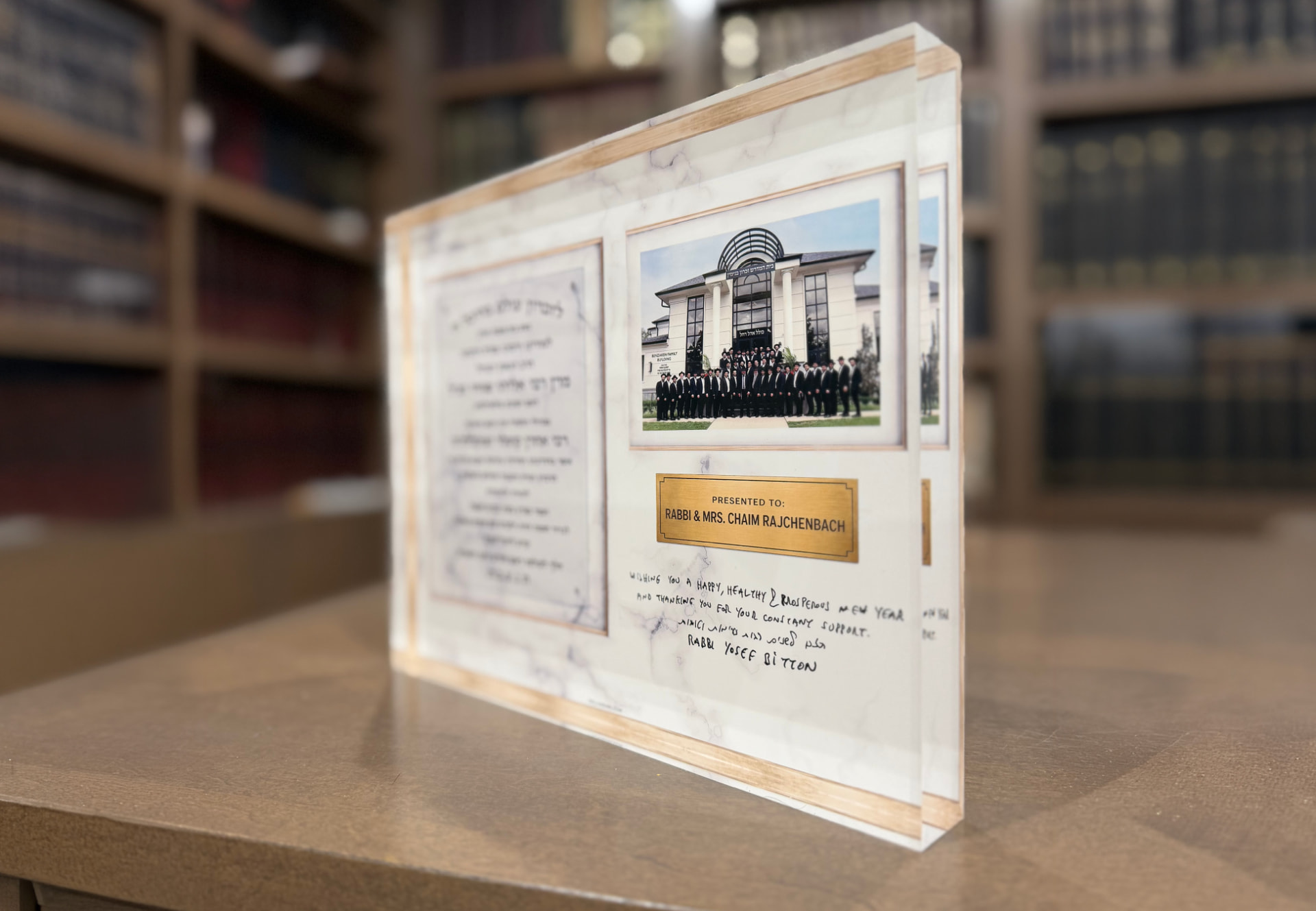 Custom marble-look donor gift with gold accents and a framed group photograph